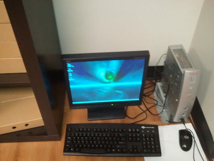 Compaq iPaq thin client running at a desk in the collection